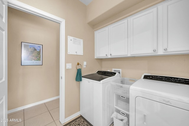 4240 E Strawberry Dr, Gilbert, AZ 85298 - laundry area with light tile patterned floors, washing machine and dryer, baseboards, and cabinet space