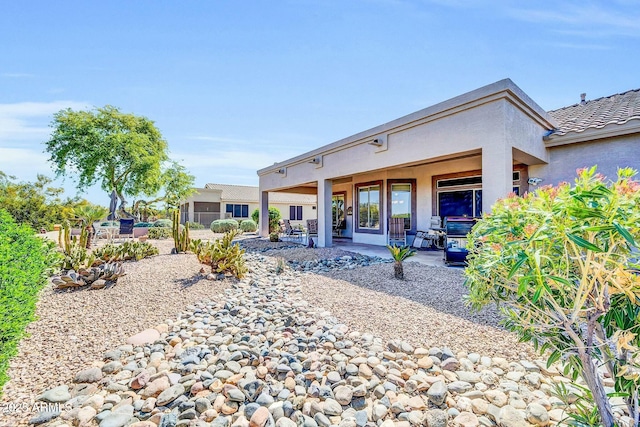 4240 E Strawberry Dr, Gilbert, AZ 85298 - rear view of property featuring stucco siding