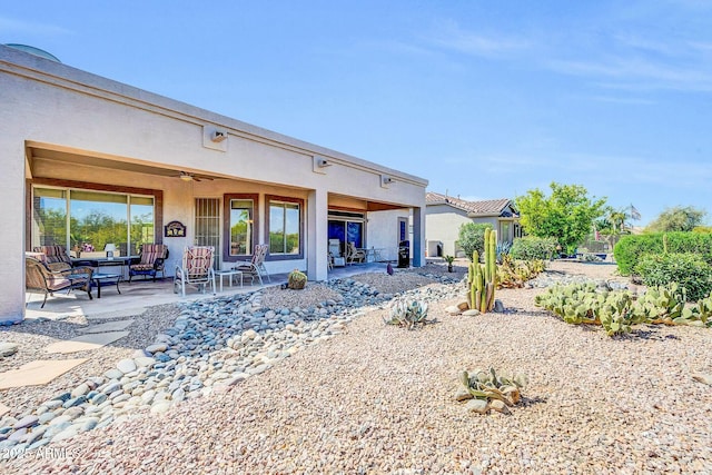 4240 E Strawberry Dr, Gilbert, AZ 85298 - rear view of house with ceiling fan, a patio, and stucco siding