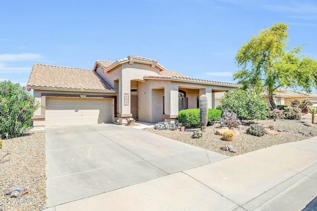 4240 E Strawberry Dr, Gilbert, AZ 85298 - view of front of house featuring concrete driveway, a tile roof, a garage, and stucco siding
