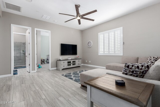 living room featuring ceiling fan