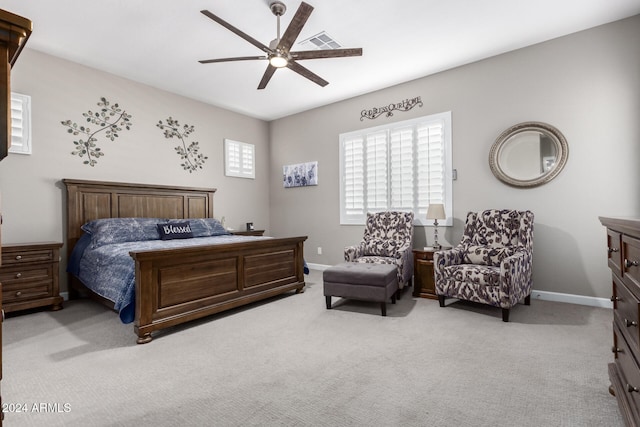 bedroom featuring ceiling fan and light carpet