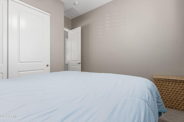 carpeted bedroom featuring a closet