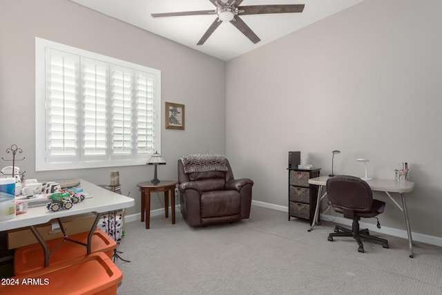 carpeted office featuring ceiling fan