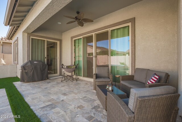 view of patio / terrace featuring ceiling fan, a grill, and an outdoor hangout area