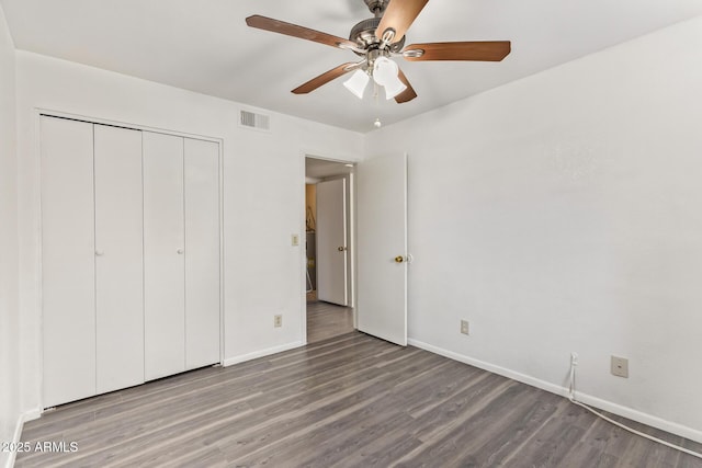1905 E University Dr Unit 139, Tempe, AZ 85288 - unfurnished bedroom with wood finished floors, a closet, and a ceiling fan