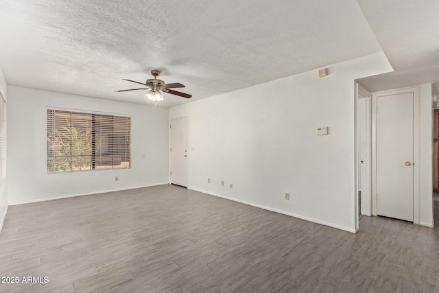 1905 E University Dr Unit 139, Tempe, AZ 85288 - empty room featuring ceiling fan, wood finished floors, and a textured ceiling
