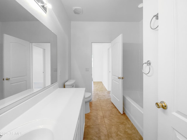 full bathroom featuring tile patterned flooring, toilet, and vanity