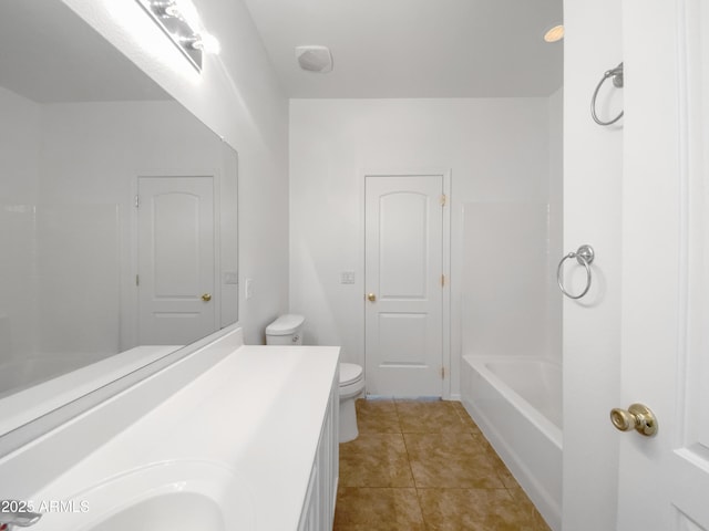 full bathroom with toilet, vanity, and tile patterned flooring