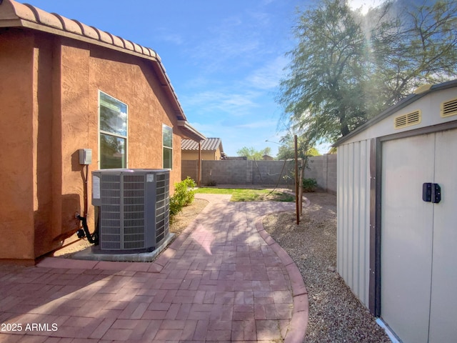 view of patio / terrace featuring central AC and a fenced backyard