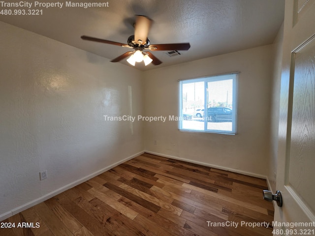 spare room featuring ceiling fan and wood-type flooring