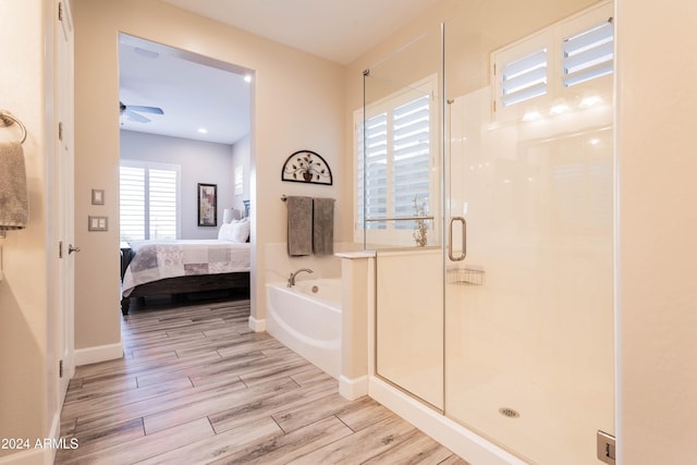 bathroom featuring ceiling fan and walk in shower