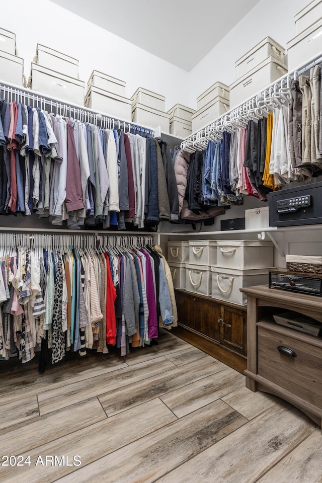 spacious closet featuring hardwood / wood-style floors