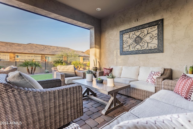 view of patio / terrace with a mountain view and an outdoor hangout area