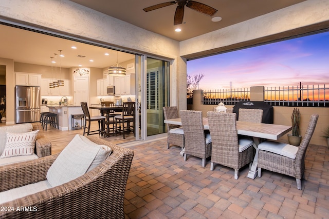 view of patio terrace at dusk