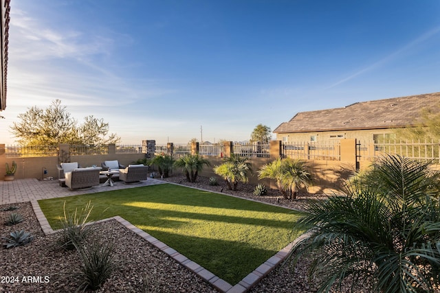 view of yard with an outdoor living space and a patio