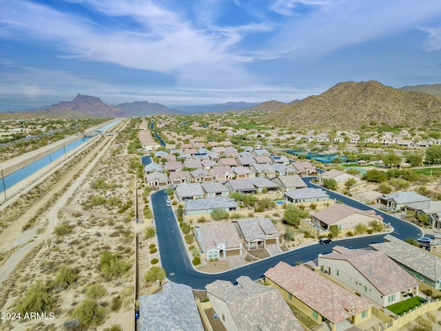 birds eye view of property with a mountain view