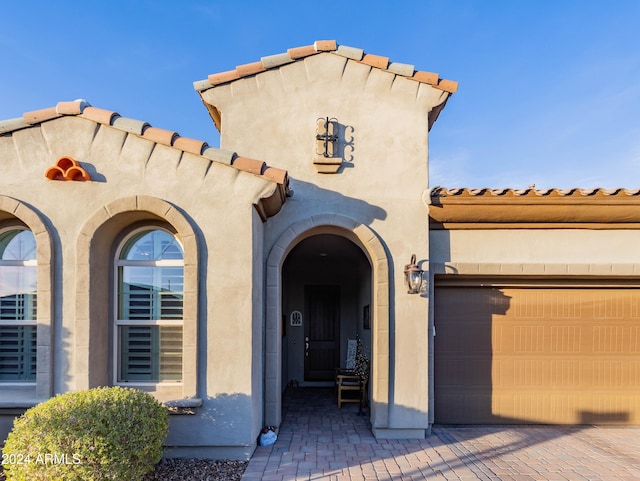 property entrance with a garage