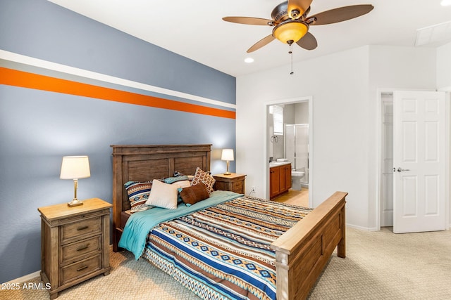 carpeted bedroom with connected bathroom and ceiling fan