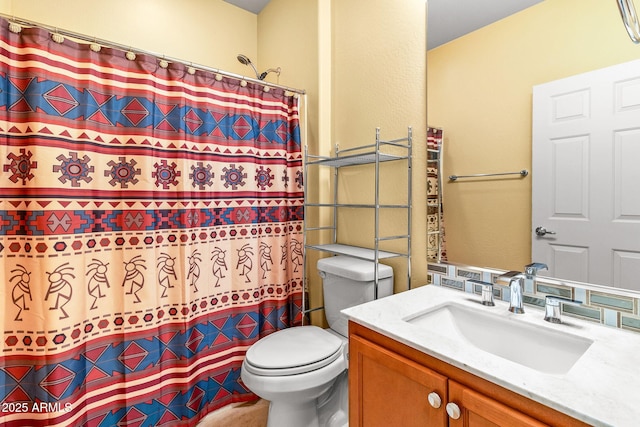 bathroom featuring vanity, toilet, and walk in shower