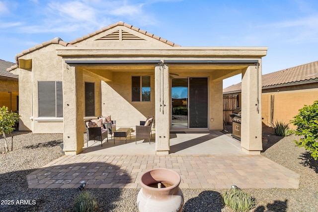 back of house featuring a patio and an outdoor hangout area