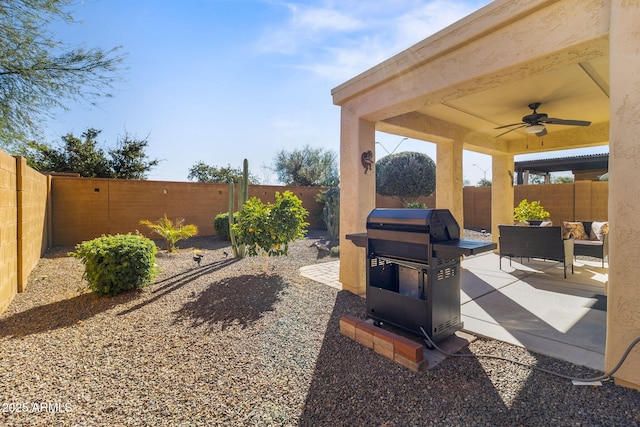 view of patio featuring ceiling fan and grilling area