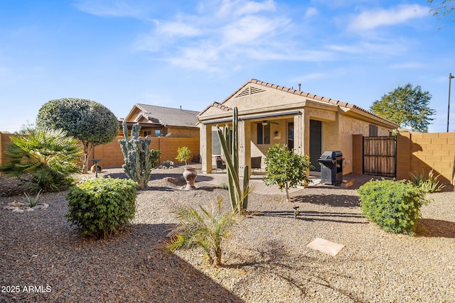 back of house with a patio