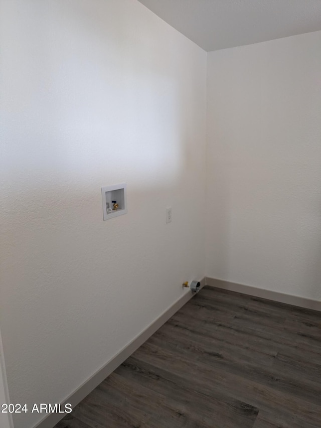 clothes washing area featuring dark hardwood / wood-style floors, gas dryer hookup, and hookup for a washing machine