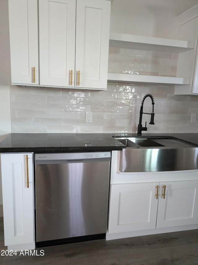 kitchen with backsplash, white cabinetry, stainless steel dishwasher, and dark hardwood / wood-style floors