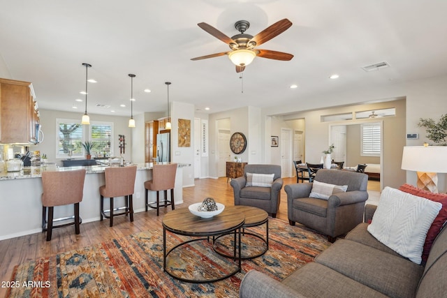 28351 N 130th Dr, Peoria, AZ 85383 - living area featuring a ceiling fan, wood finished floors, and recessed lighting