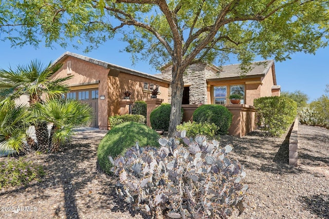 28351 N 130th Dr, Peoria, AZ 85383 - view of front of property with stucco siding, fence, and stone siding