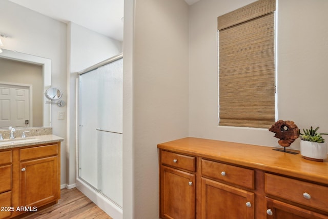 28351 N 130th Dr, Peoria, AZ 85383 - full bath with a shower stall, vanity, and wood finished floors