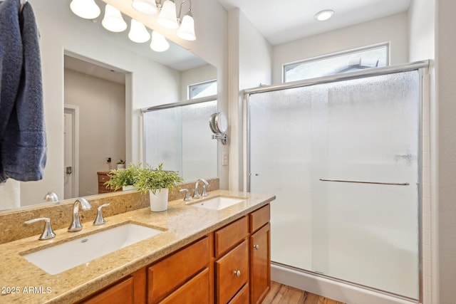 28351 N 130th Dr, Peoria, AZ 85383 - full bathroom featuring a stall shower, wood finished floors, and double vanity