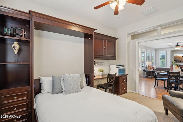 28351 N 130th Dr, Peoria, AZ 85383 - bedroom featuring a desk, light carpet, and a ceiling fan