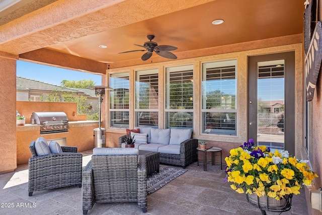 28351 N 130th Dr, Peoria, AZ 85383 - view of patio / terrace featuring grilling area, an outdoor kitchen, ceiling fan, an outdoor living space, and fence