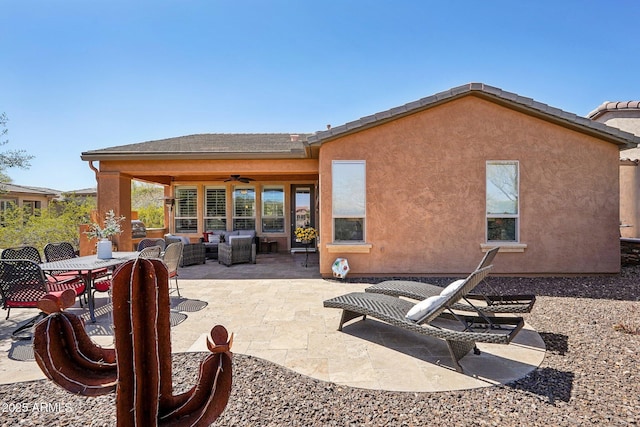 28351 N 130th Dr, Peoria, AZ 85383 - rear view of house with a ceiling fan, a patio, stucco siding, and an outdoor living space