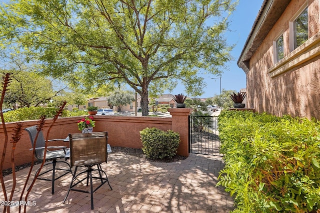 28351 N 130th Dr, Peoria, AZ 85383 - view of patio / terrace with a gate and outdoor dining space