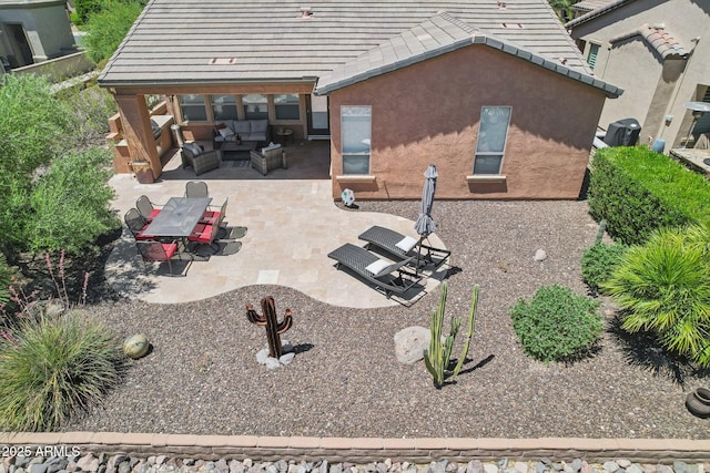 28351 N 130th Dr, Peoria, AZ 85383 - back of house with an outdoor living space, a patio, stucco siding, a tiled roof, and central air condition unit