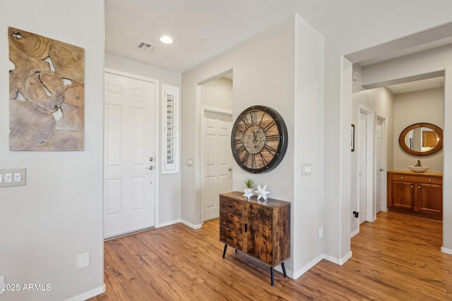 28351 N 130th Dr, Peoria, AZ 85383 - foyer entrance with light wood-style floors and baseboards