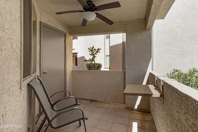 view of patio / terrace with ceiling fan and a balcony