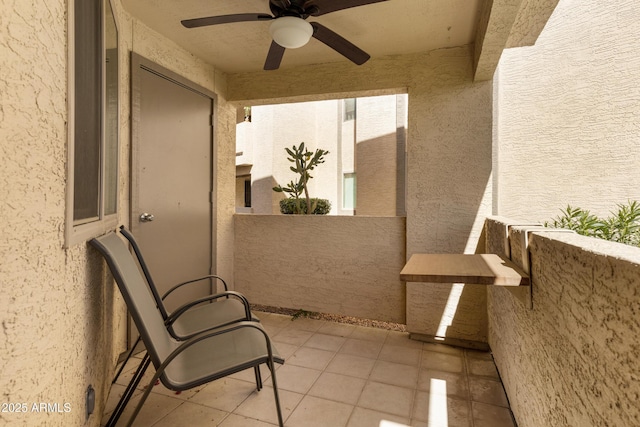 view of patio with a balcony and ceiling fan