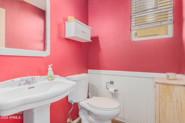 bathroom featuring sink and toilet