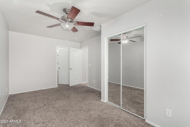 unfurnished bedroom featuring a closet, carpet flooring, ceiling fan, and baseboards