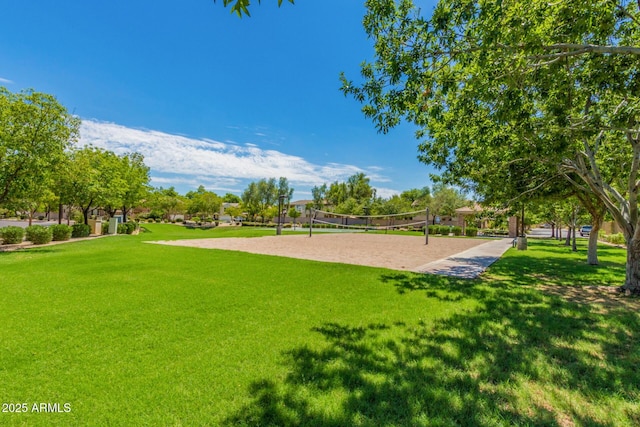 view of community featuring a lawn and volleyball court