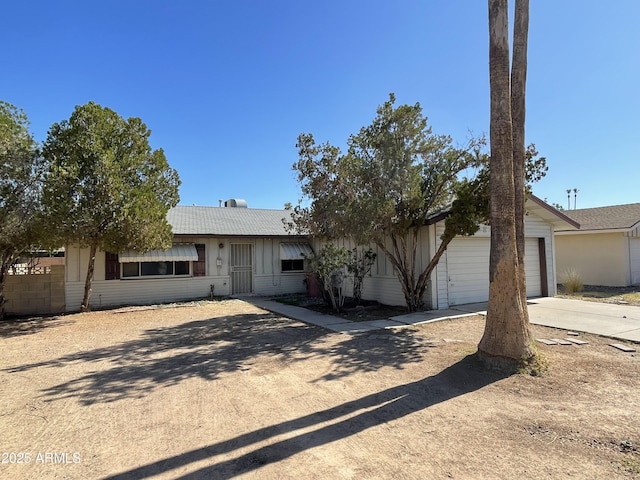 8114 E Jackrabbit Rd, Scottsdale, AZ 85250 - ranch-style house featuring driveway and a garage