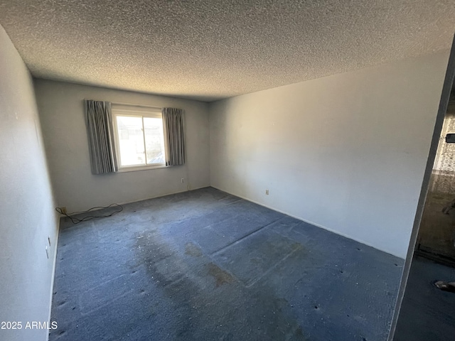8114 E Jackrabbit Rd, Scottsdale, AZ 85250 - unfurnished room with a textured ceiling and carpet floors
