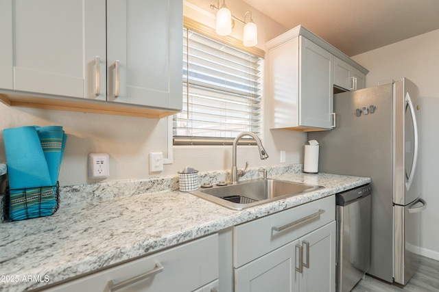 kitchen featuring a sink and dishwasher