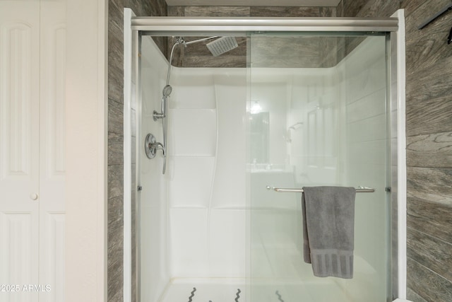 full bath featuring a shower stall