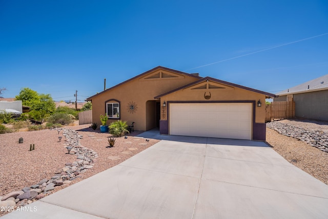 single story home with fence, a garage, driveway, and stucco siding