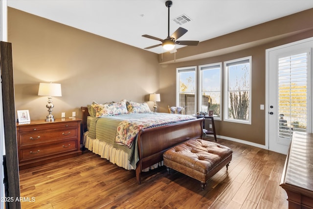 bedroom with access to exterior, hardwood / wood-style floors, and ceiling fan